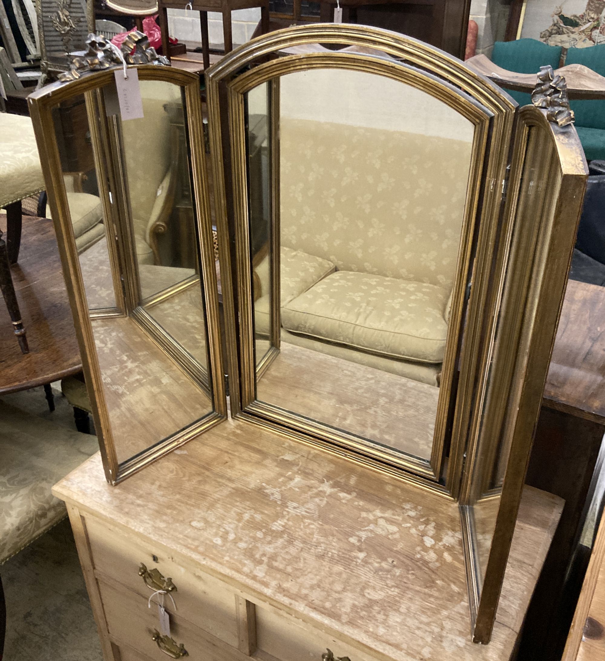 A giltwood and gesso triple folding dressing table mirror, width 106cm, height 78cm